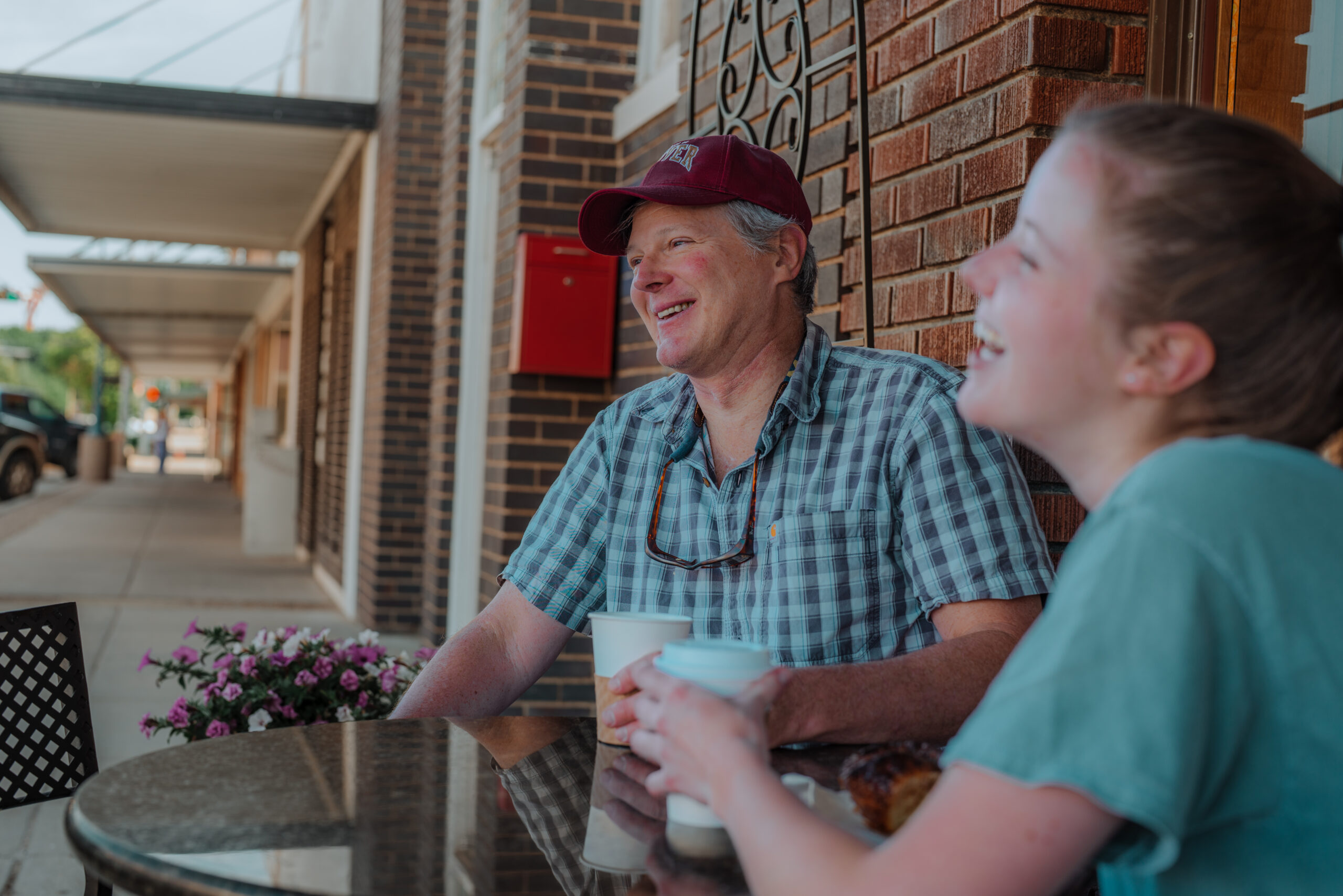 A father and daughter share coffee and conversation outside The Bread Doctor bakery in Torrington, Wyoming.